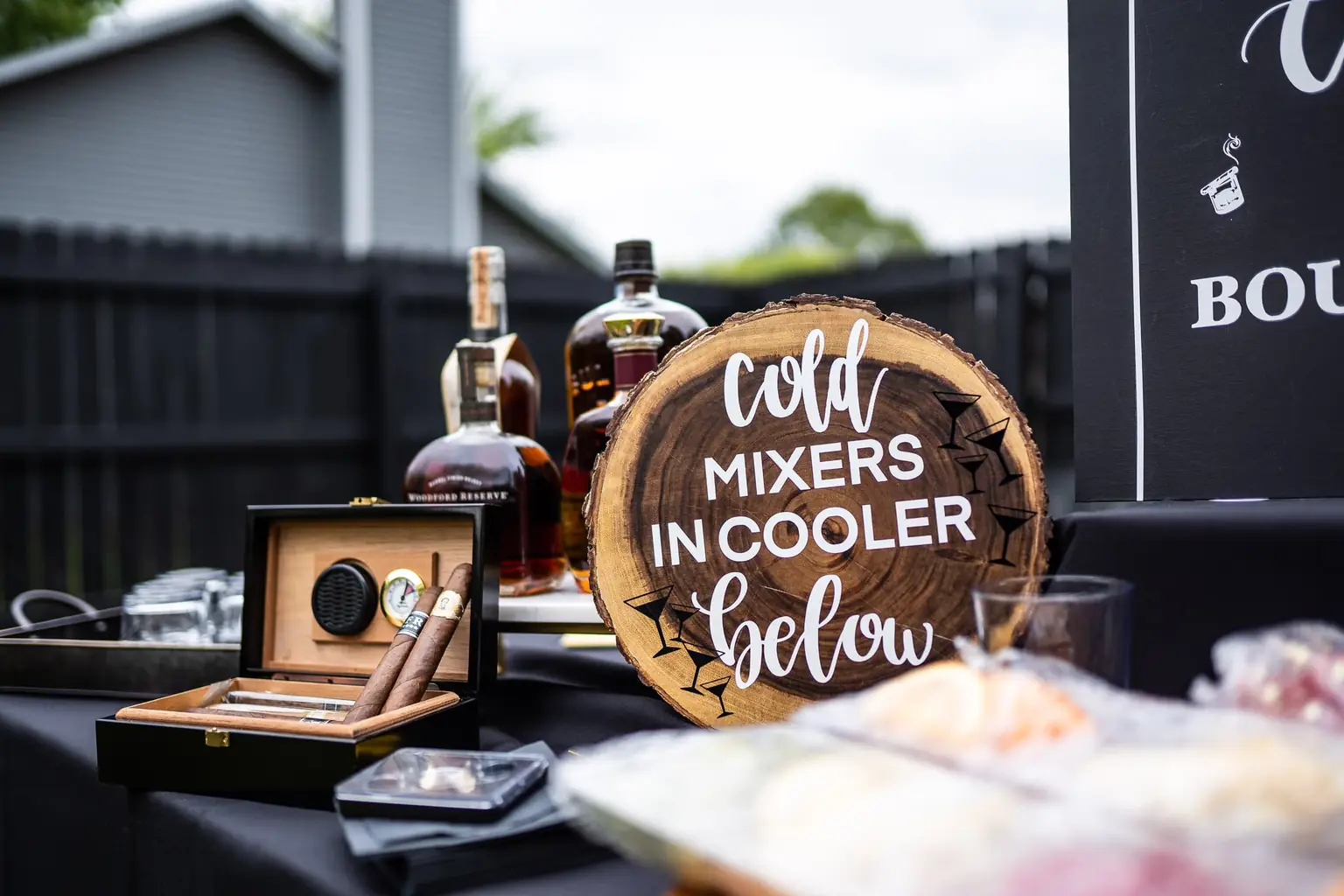 Whiskey and cigar bar detail at an event styled in black, photographed by Ken Floyd Media